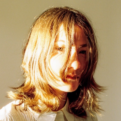 Rowena Wise's face quite close, with her hair falling across her face